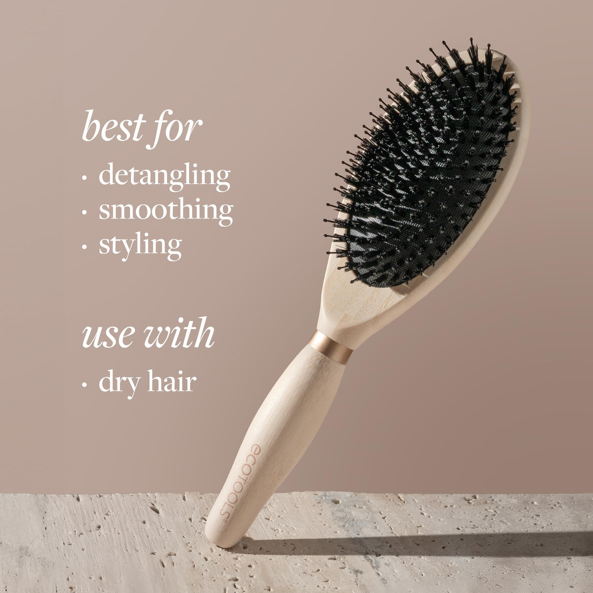 EcoTools Dual Bristle Hair Brush in lifestyle setting on a bathroom counter