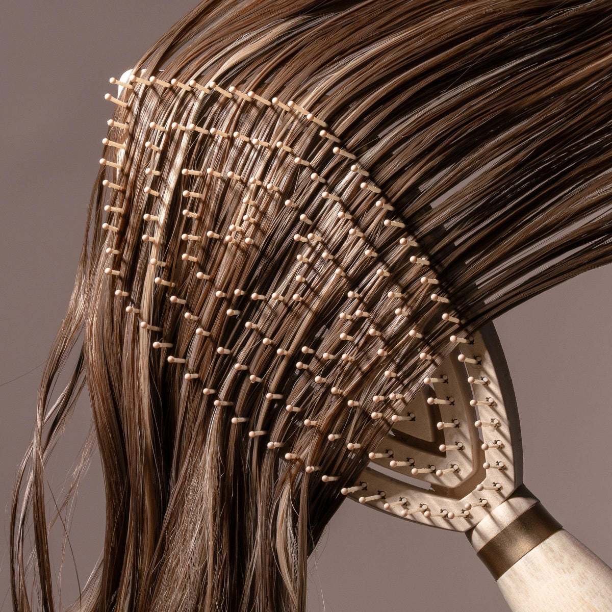 EcoTools Fine Hair Detangler Brush in use on wet hair