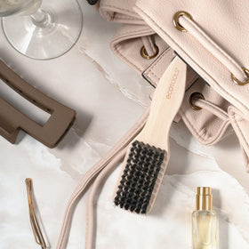 EcoTools Mini Slick Back Hair Brush in travel pouch