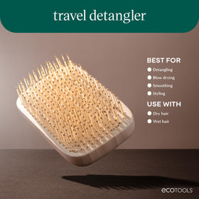 EcoTools Travel Detangler Hairbrush in a cosmetic bag for travel