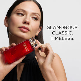 Elegant door-shaped bottle of Elizabeth Arden Red Door perfume