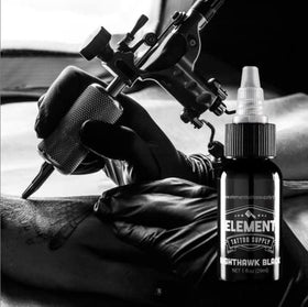Element Tattoo Supply Nighthawk Black Ink 4oz bottle in a tattoo studio