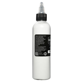 Element Tattoo Supply White Tattoo Ink 4oz bottle in a tattoo studio
