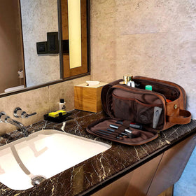 Elviros Toiletry Bag on travel suitcase for easy transport