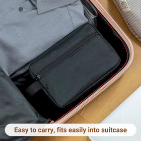 Elviros Toiletry Bag with various toiletries spread around