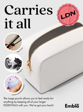 Embla Large Makeup Bag lifestyle scene with travel items