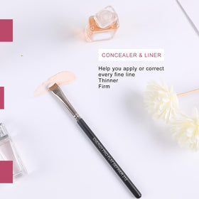 ENERGY Flat Definer Makeup Brush 212 in a makeup setup with products