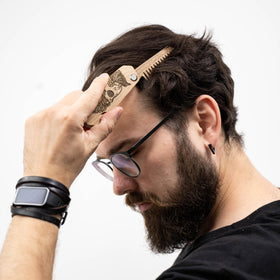 Enjoy The Wood Beard Comb displayed on a wooden surface