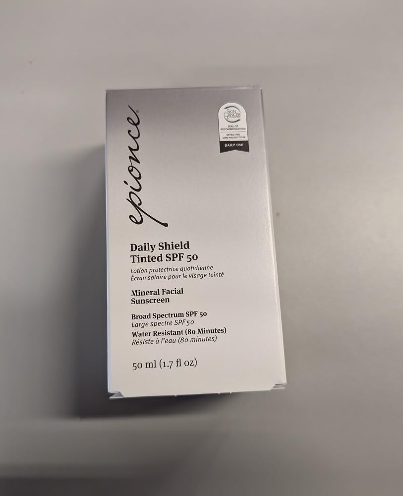 Epionce Daily Shield Tinted SPF 50 on a vanity with makeup