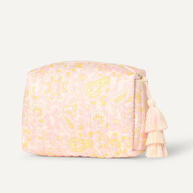 Essentials Quilted Makeup Toiletry Bag displayed with beauty products