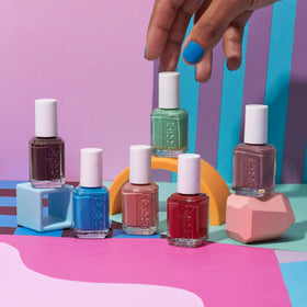 essie Coral Nail Polish application on nails with glossy finish