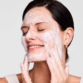Estée Lauder Perfectly Clean Cream Face Wash on a bathroom counter