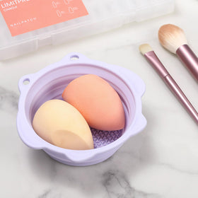 Etercycle Foldable Silicone Makeup Brush Cleaner Bowl in use with brush