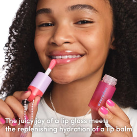 Evereden Kids Tinted Lip Oil in a playful setting