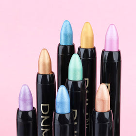 evpct eye shadow stick in various shades on a makeup palette