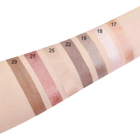 evpct eyeshadow sticks in hand with makeup brush