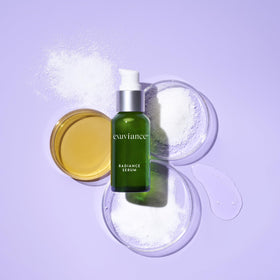 EXUVIANCE Radiance Serum 1 fl. oz. on a vanity