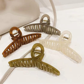 FAELBATY Big Hair Claw Clips in light pink, jade green, brown, and grey