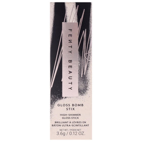 FENTY BEAUTY Gloss Bomb Stix Shimmer 05 Flamingo Fling lipstick in hand