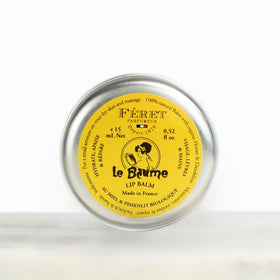 Feret Parfumeur balm on a wooden table