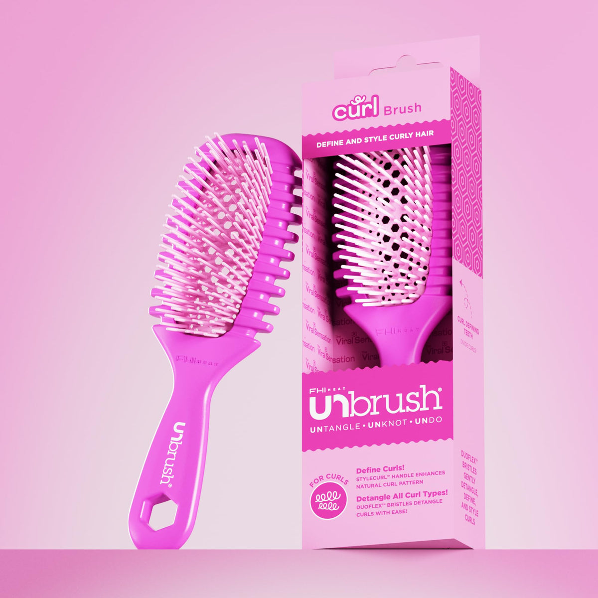 FHI Heat UNbrush Curl Detangling Brush in hand