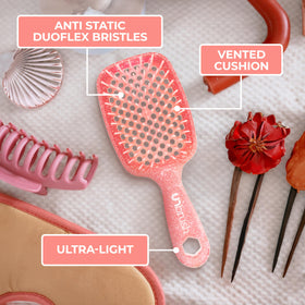 FHI Heat UNbrush Detangling Brush Ruby Peach in use on wet hair