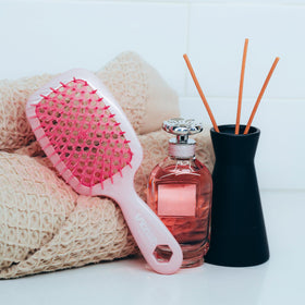FHI Heat UNbrush Detangling Brush with packaging displayed