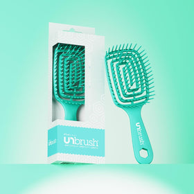 FHI Heat UNbrush Flex Detangling Brush in a bathroom setting