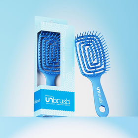 FHI Heat UNbrush Flex Detangling Brush in hand, demonstrating ease of use