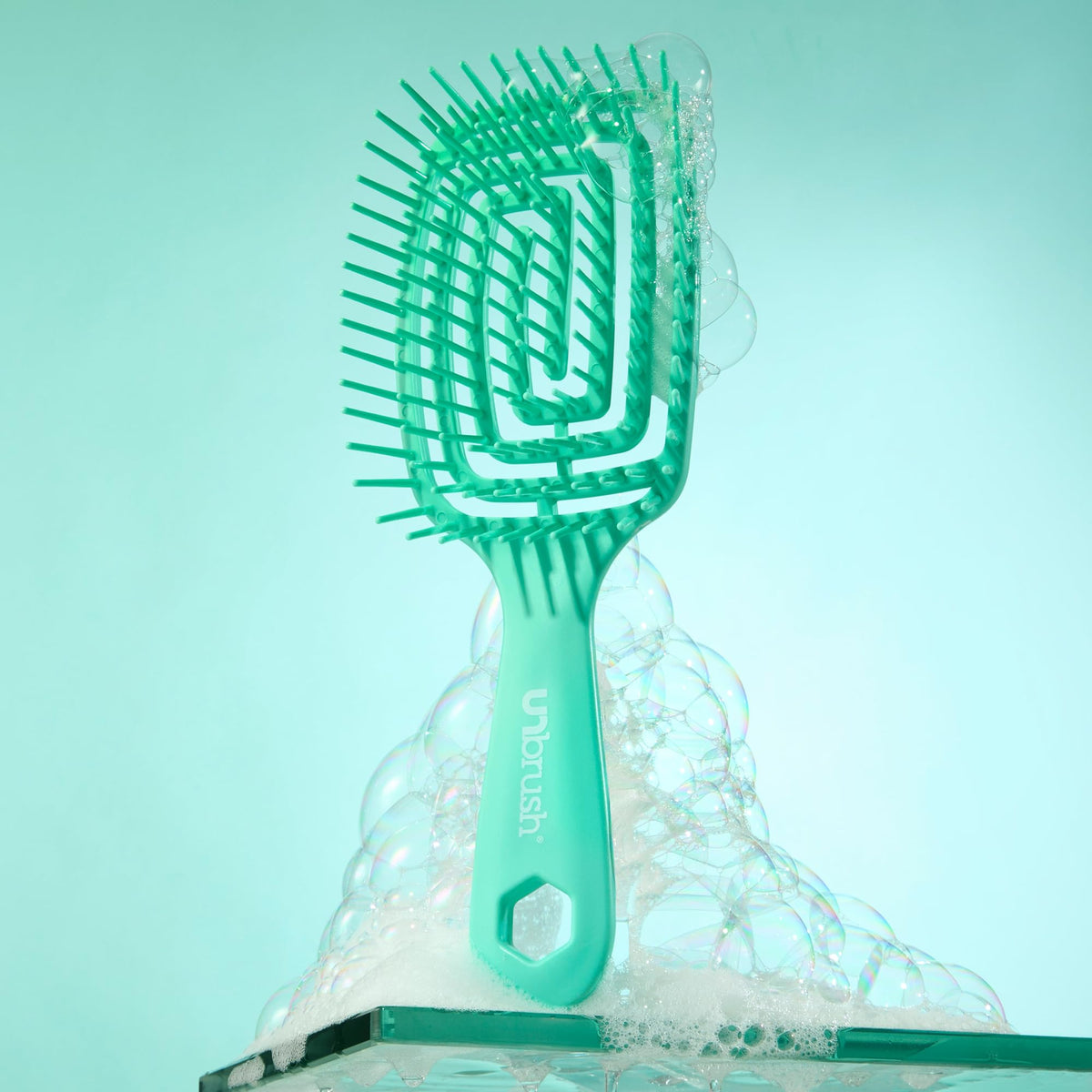 FHI Heat UNbrush Flex Detangling Brush on a vanity