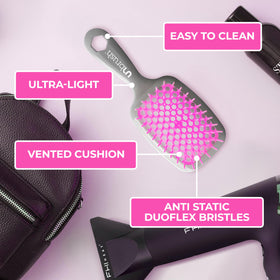 FHI Heat Unbrush Wet & Dry Detangling Hair Brush on a bathroom countertop