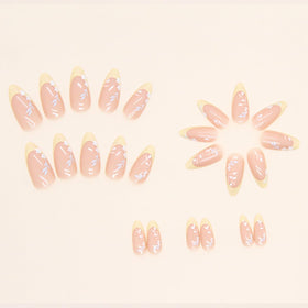 FJSMTOPl Flower Almond Press on Nails displayed on a table