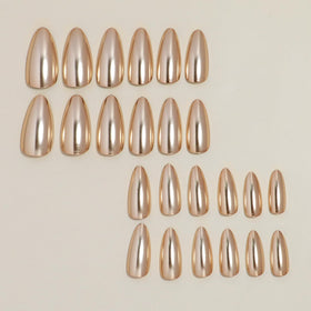 FJSMTOPl Gold Press on Nails applied on hands