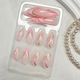 FJSMTOPl pink French tip press on nails displayed on a table