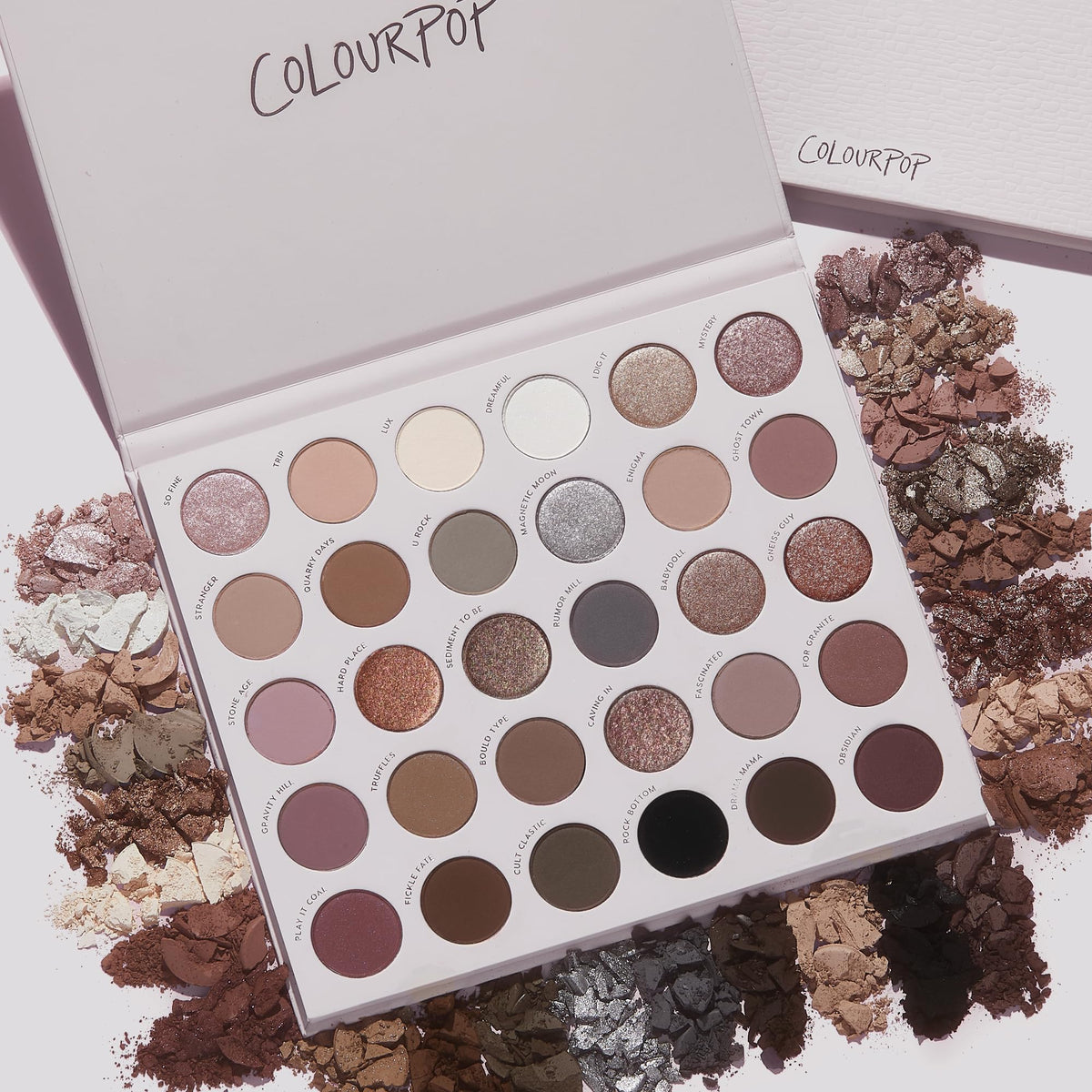 Flat lay of ColourPop Stone Cold Fox Eyeshadow Palette with brushes