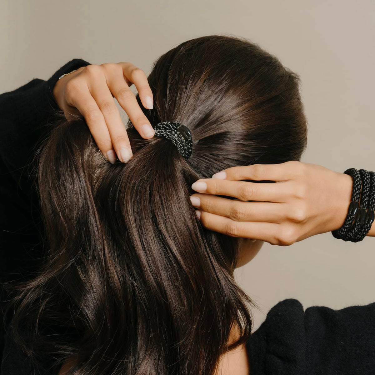 Flat lay of L. Erickson ponytail holders on a table