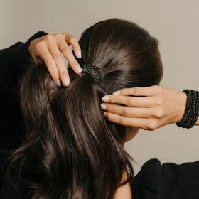 Flat lay of L. Erickson ponytail holders on a table