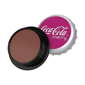 Flat lay of Lip Smacker Coca Cola lip balm trio