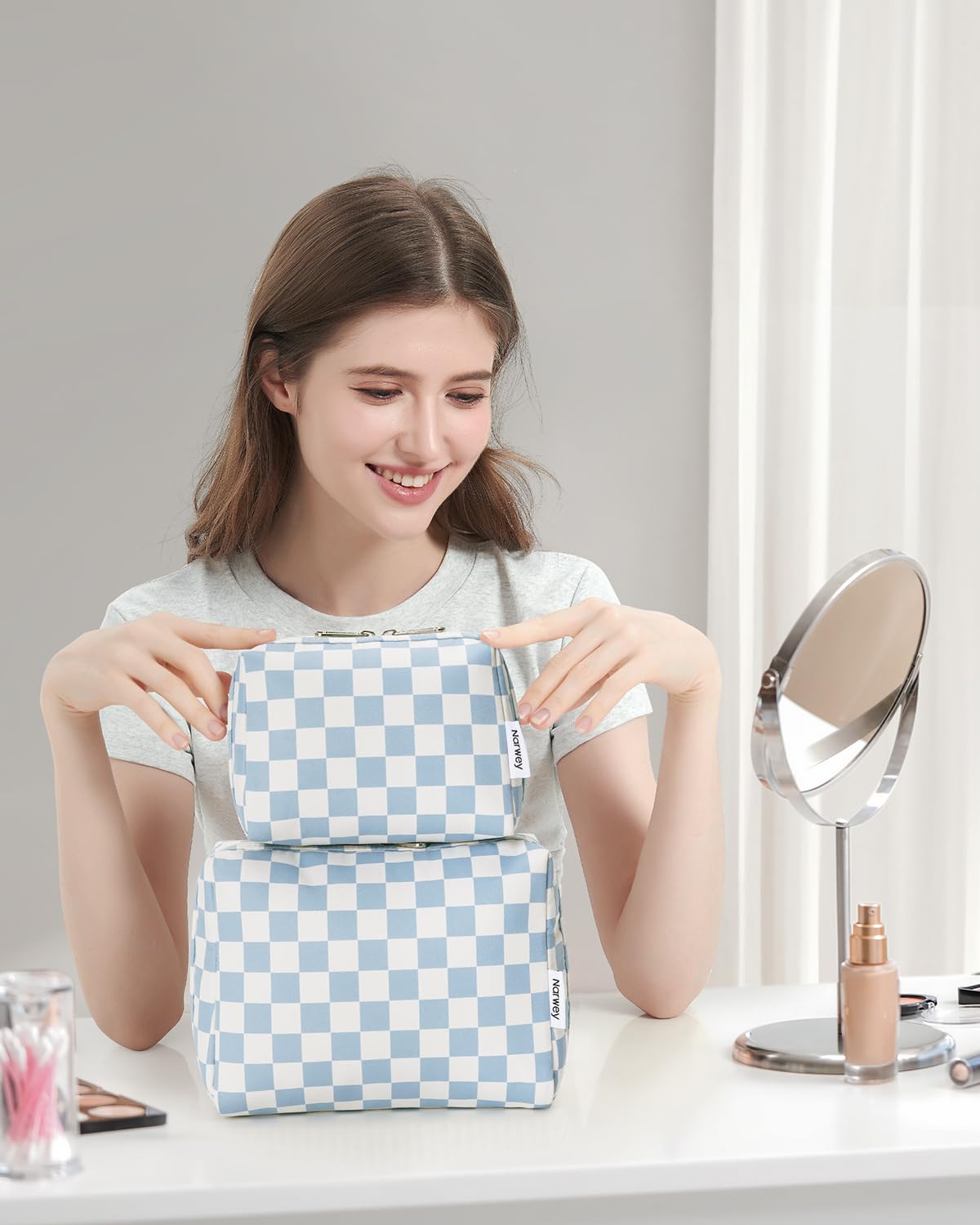 Flat lay of Narwey makeup pouch with various cosmetics
