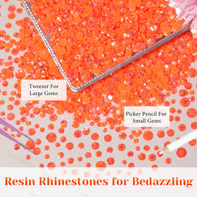 Flatback orange rhinestones displayed on a craft surface