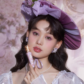 Flower Knows Hot Pink Shimmer Lip Gloss with floral background