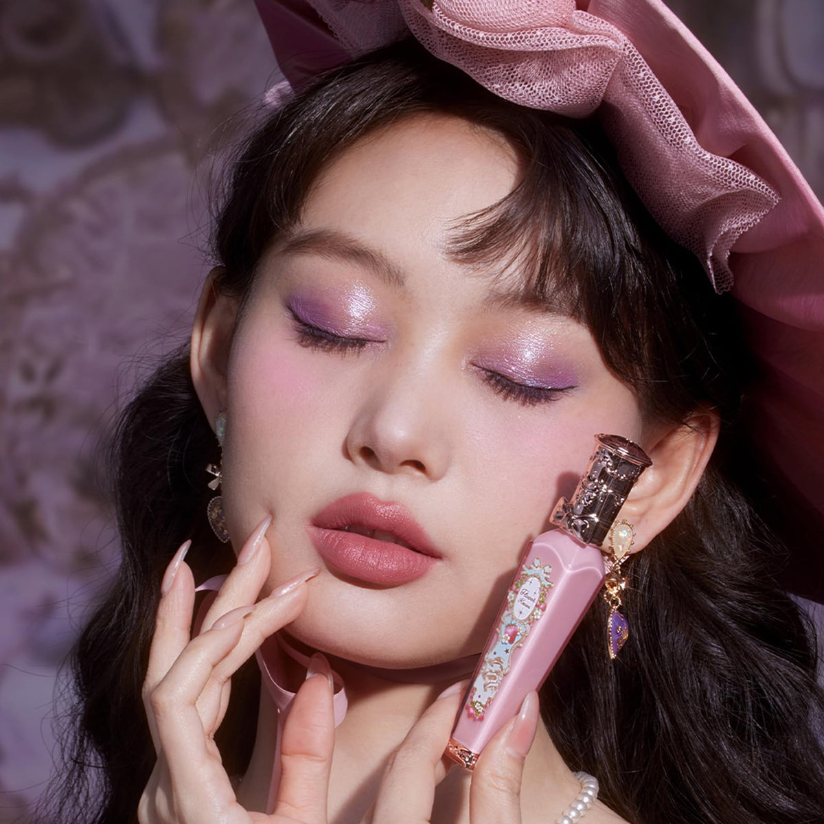 Flower Knows Lip Cream in hand showcasing texture