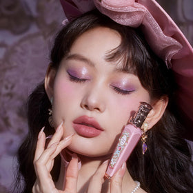 Flower Knows Lip Cream in hand showcasing texture