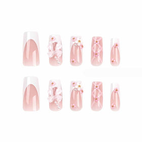 Foccna Press on Nails arranged with a nail file and adhesive tabs