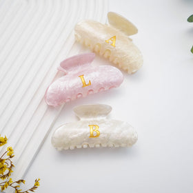 Fohufo Hair Claw Clip on a vanity with other hair accessories