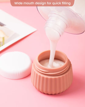 Four silicone face cream jars in different colours