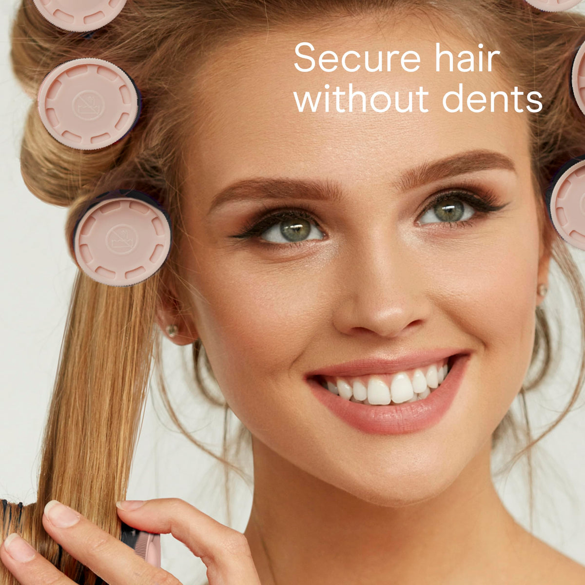 Four small ¾ inch Conair hot rollers arranged together