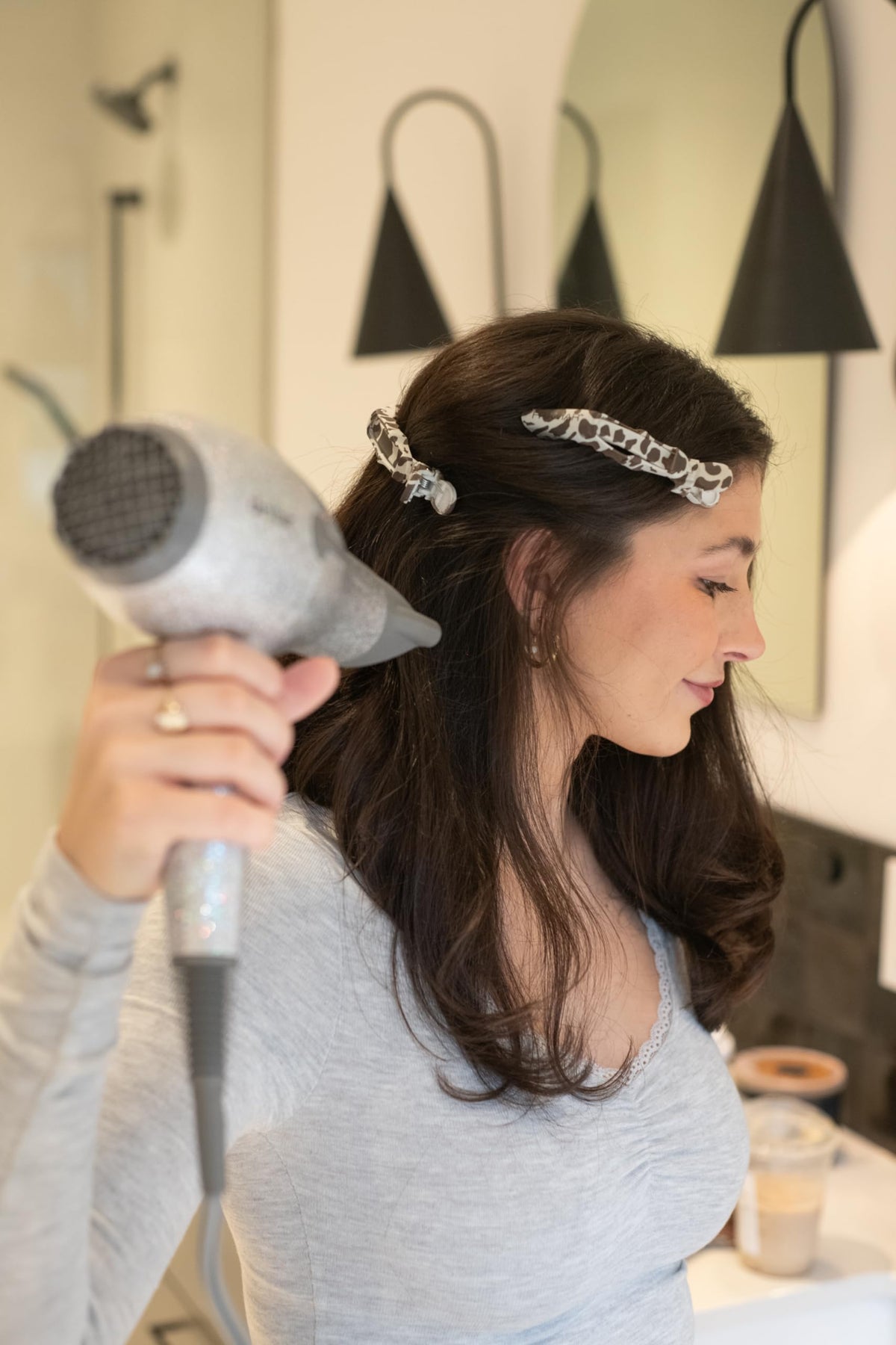FRAMAR Cow Print Alligator Clips in use during hair styling