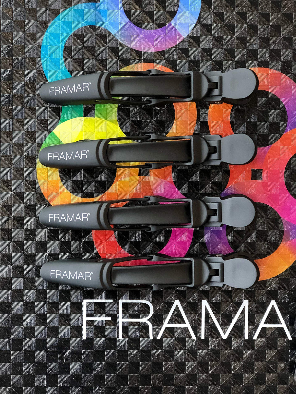 FRAMAR Gator Grips Black Hair Clips on a vanity