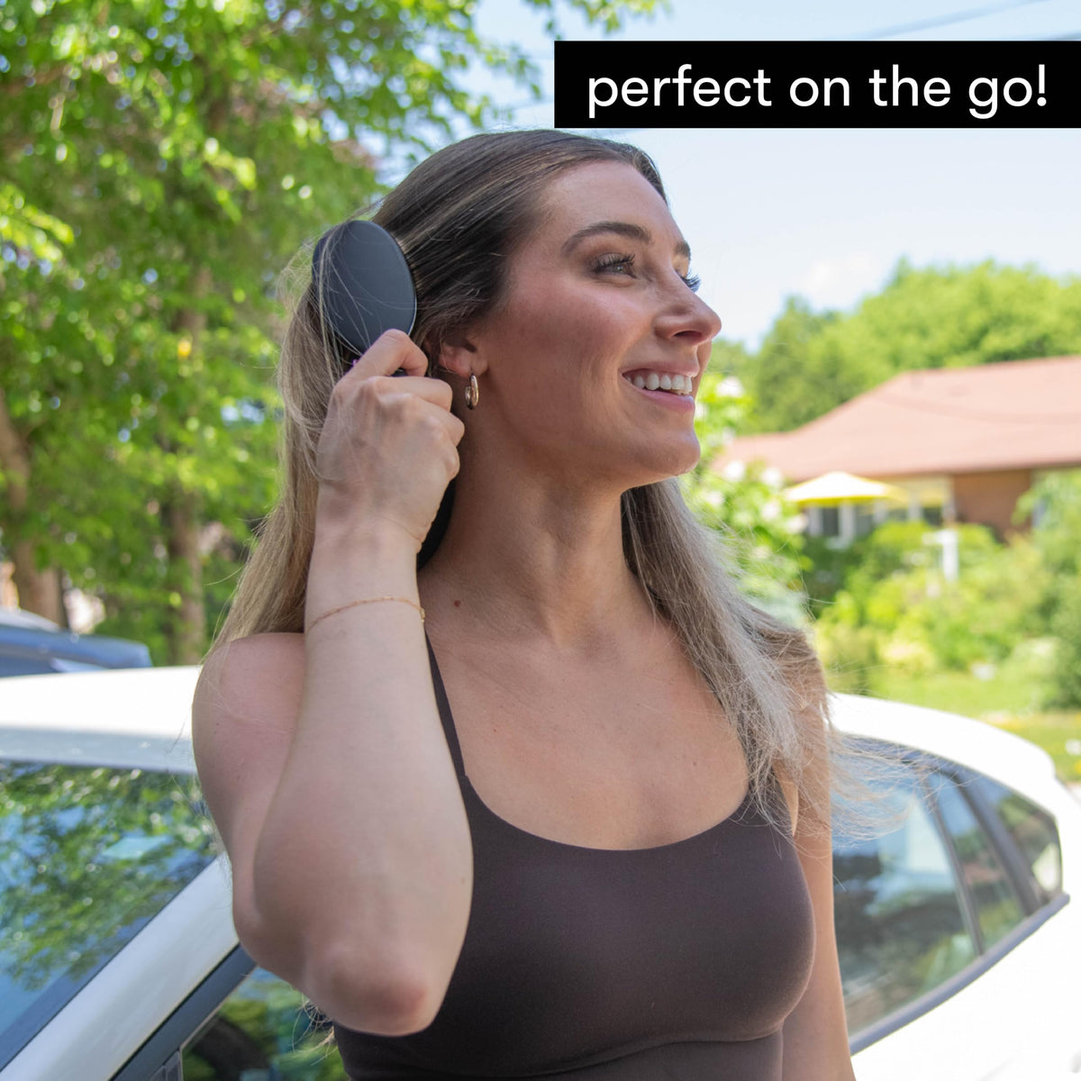 FRAMAR Mini Hair Brush Detangler compact size in a hand